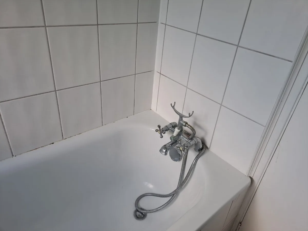 Bath cleaned to a bright white finish after a deep clean